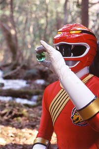 Red Ranger holding crystal of the Gorilla