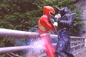 Red Ranger getting beaten into a rail by Zenaku