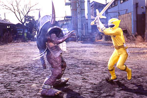 Yellow Ranger attacking Camera Org with her Golden Sword